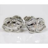 A pair of 14ct white gold earrings set with baguet