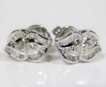 A pair of 14ct white gold earrings set with baguet