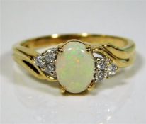 A 9ct gold ring set with diamonds & opal 2.6g size