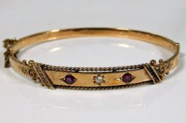 A 15ct gold bangle set with diamond & ruby, inscri