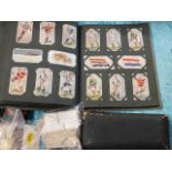 A small quantity of cigarette cards twinned with a