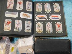 A small quantity of cigarette cards twinned with a