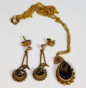 A pair of 9ct gold mounted smokey quartz drop earr