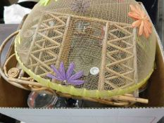 A cake fly net twinned with other kitchen sundries