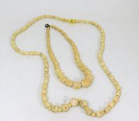 A carved ivory & bone necklace twinned with a smal