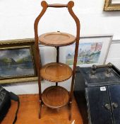 An Edwardian mahogany three tier cake stand