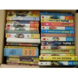 A boxed quantity over two levels of vintage W. E. Johns Biggles books, approx. 61