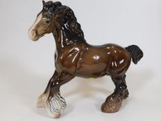 A Beswick cantering shire horse 8in tall