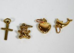 Four small 9ct gold charms 2g