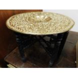An Anglo Indian occasional table on carved wood st
