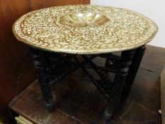 An Anglo Indian occasional table on carved wood st