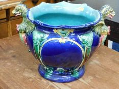 A majolica jardiniere with dragon handles, chipped