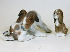 A Lladro dog with butterfly on his tail twinned wi