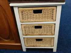 A modern cabinet of wicker drawers