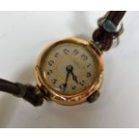 A ladies watch with 9ct gold case