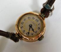 A ladies watch with 9ct gold case