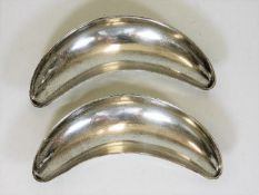 A pair of silver crescent shaped dishes approx. 12