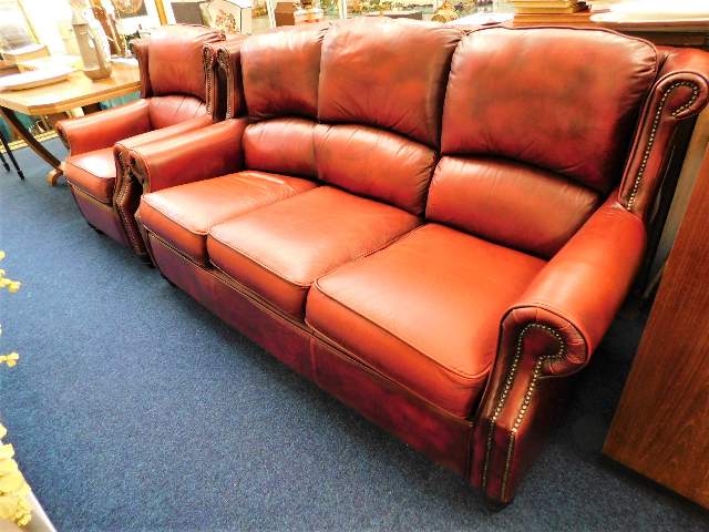 A Thomas Lloyd leather antique style three seater