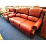 A Thomas Lloyd leather antique style three seater