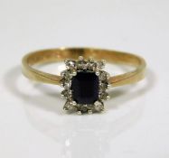 A 9ct gold ring set with diamond & sapphire 1.5g