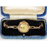 A boxed wristwatch with 9ct gold case & strap 14.7