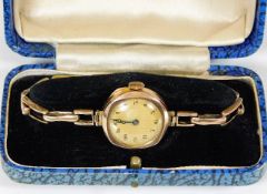 A boxed wristwatch with 9ct gold case & strap 14.7