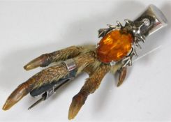 A hallmarked Scottish silver mounted grouse claw k