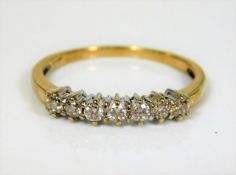 A 9ct gold ring set with seven diamonds 1.6g
