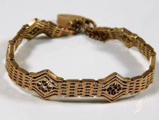 A good quality ladies 9ct gold bracelet with padlo