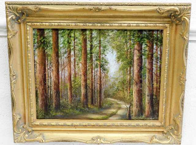 A gilt framed M. Hall oil painting of woodland sce