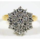 An 18ct gold diamond cluster ring set with 19 ston