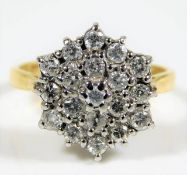 An 18ct gold diamond cluster ring set with 19 ston