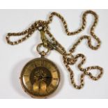 A 9ct gold cased pocket watch with yellow metal ch