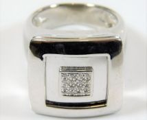 A substantial 18ct white gold ring set with diamon