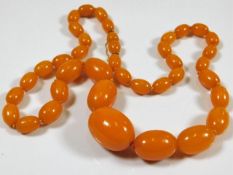 A set of amber beads 24in long approx. 58.18g
