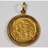 A George V 1918 full gold sovereign within 9ct gold holder approx. 12.07g