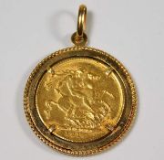 A George V 1918 full gold sovereign within 9ct gold holder approx. 12.07g