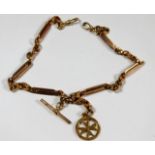 A Victorian 9ct rose gold double Albert chain with