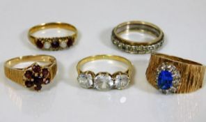 Five 9ct gold rings set with various paste & stone