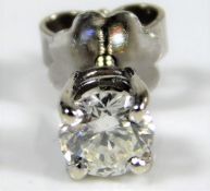 An 18ct gold mounted single screw stud diamond ear