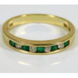 A 14ct gold diamond & emerald ring approx. 2.2g si
