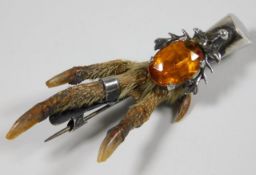 A Scottish silver mounted grouse claw with citrine