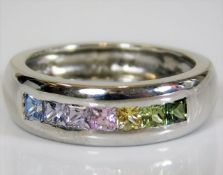 A large 18ct gold ring set with rainbow sapphire s
