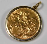 A George V 1911 full gold sovereign within 9ct gold holder approx. 9.3g