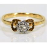 A yellow metal, tests at 18ct, diamond ring approx. 2.5g, size M £100-150