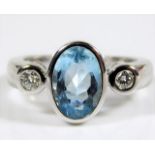 An 18ct white gold ring set with topaz & diamond a