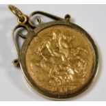 A Victorian 1888 full gold sovereign within 9ct gold holder approx. 9.9g