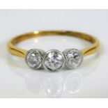 An 18ct gold art deco style ring set with three di