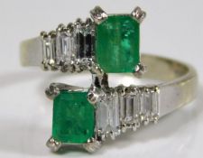 A 1960's 18ct white gold ring set with emerald & d