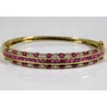 A 9ct gold bangle set with diamond & ruby approx.